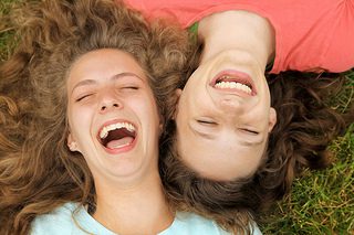 Teen girls laughing