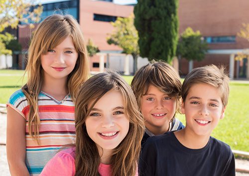 Portrait of group of kids on school campus