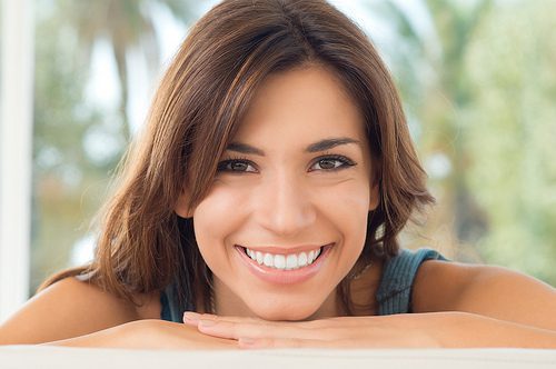 Woman smiling- Dental oral cancer screenings