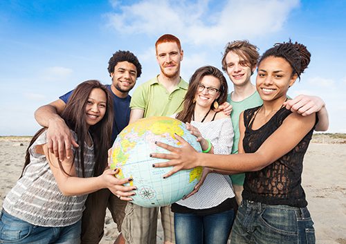 Teens holding globe