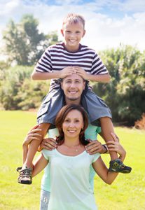 Son riding father's shoulders
