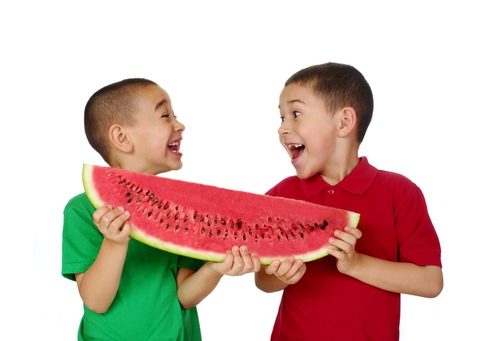 Kids holding watermelon slice